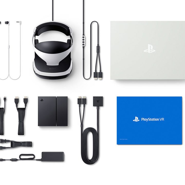 Every component that comes with the PS VR laid out on a white table.