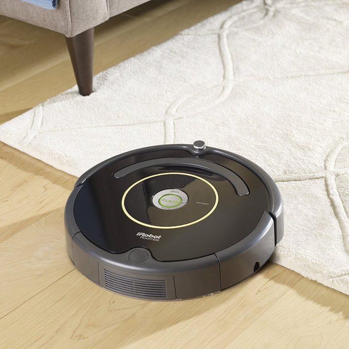 iRobot Roomba 614 Vacuum Cleaning Robot in a living room.