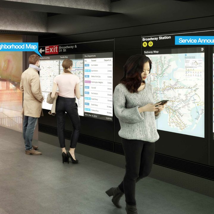 A person on their phone at the subway station.