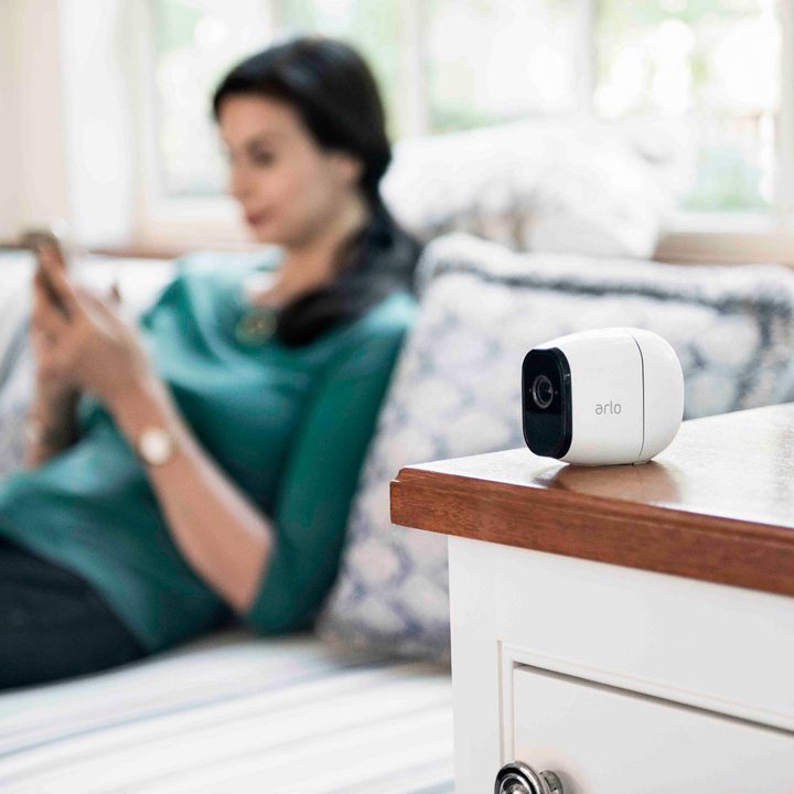 Arlo camera on top of end table.