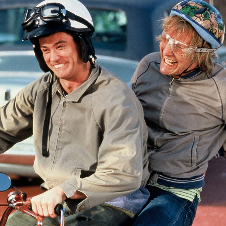 Dumber and Dumber ride a snowmobile.
