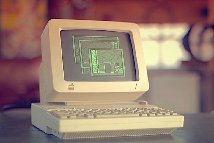 An Apple II computer on a desk.