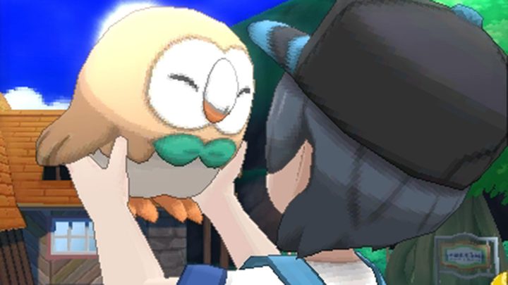 The play holds up a Rowlett in Pokemon Sun and Moon.