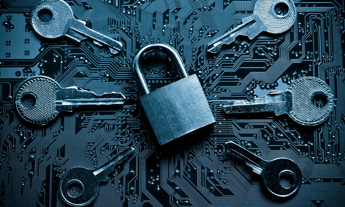 A lock surrounded by keys.