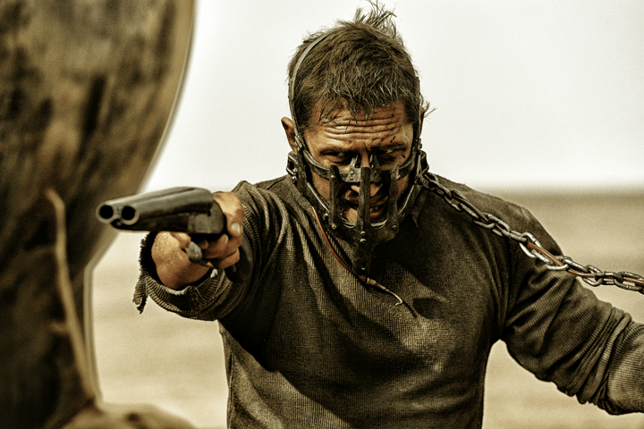 Mad Max points a gun in Mad Max: Fury Road.
