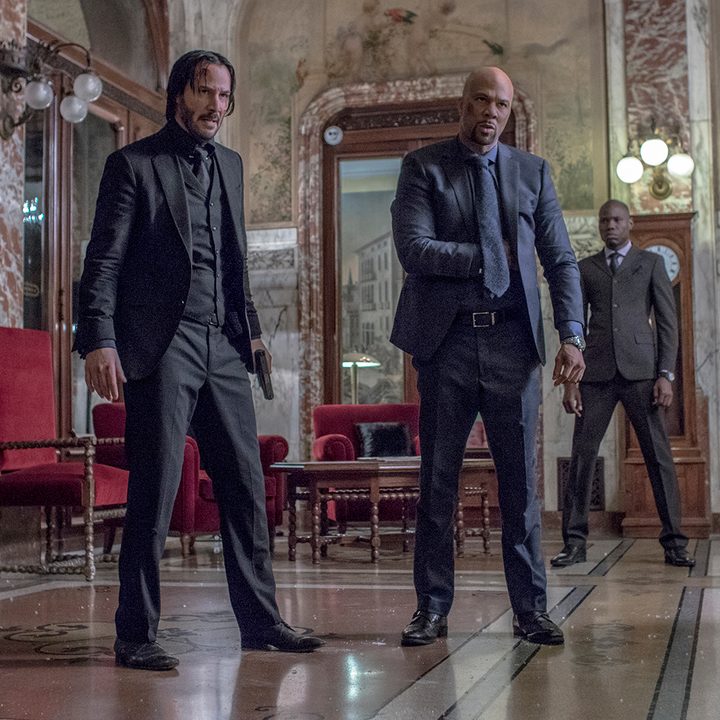 Two men stand next to each other in John Wick: chapter 2.