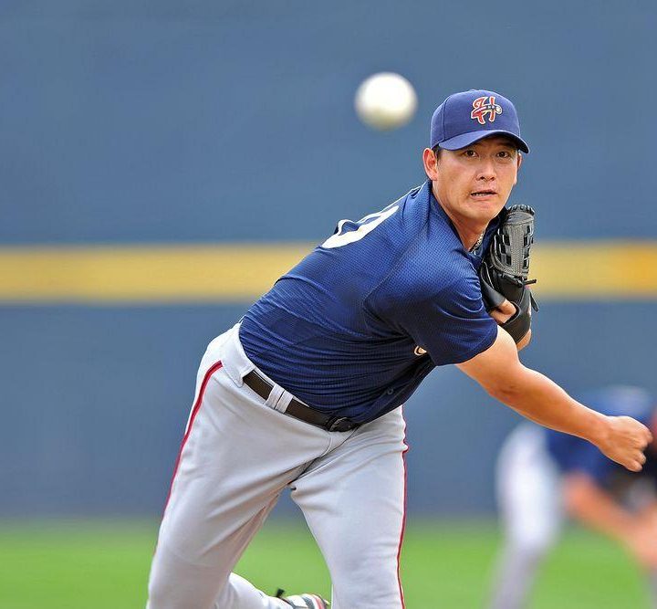 A baseball pitcher throwing a pitch.