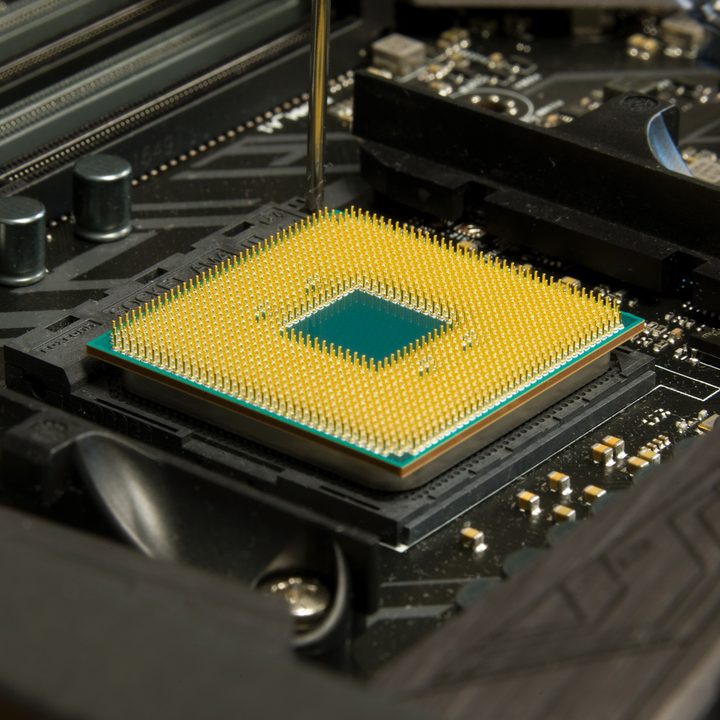Amd Ryzen 7 1700 processor sitting on a motherboard.