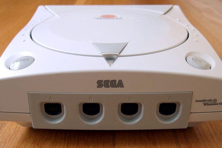 A Dreamcast sits on a table.