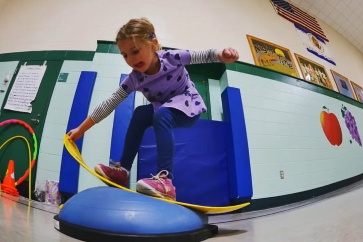 A child uses a Burton Riglet.