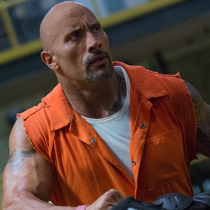 The Rock flexes in a scene in Fast 8.