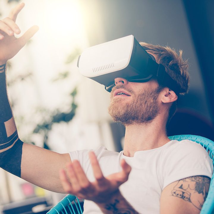 VR headset man with tattoos.