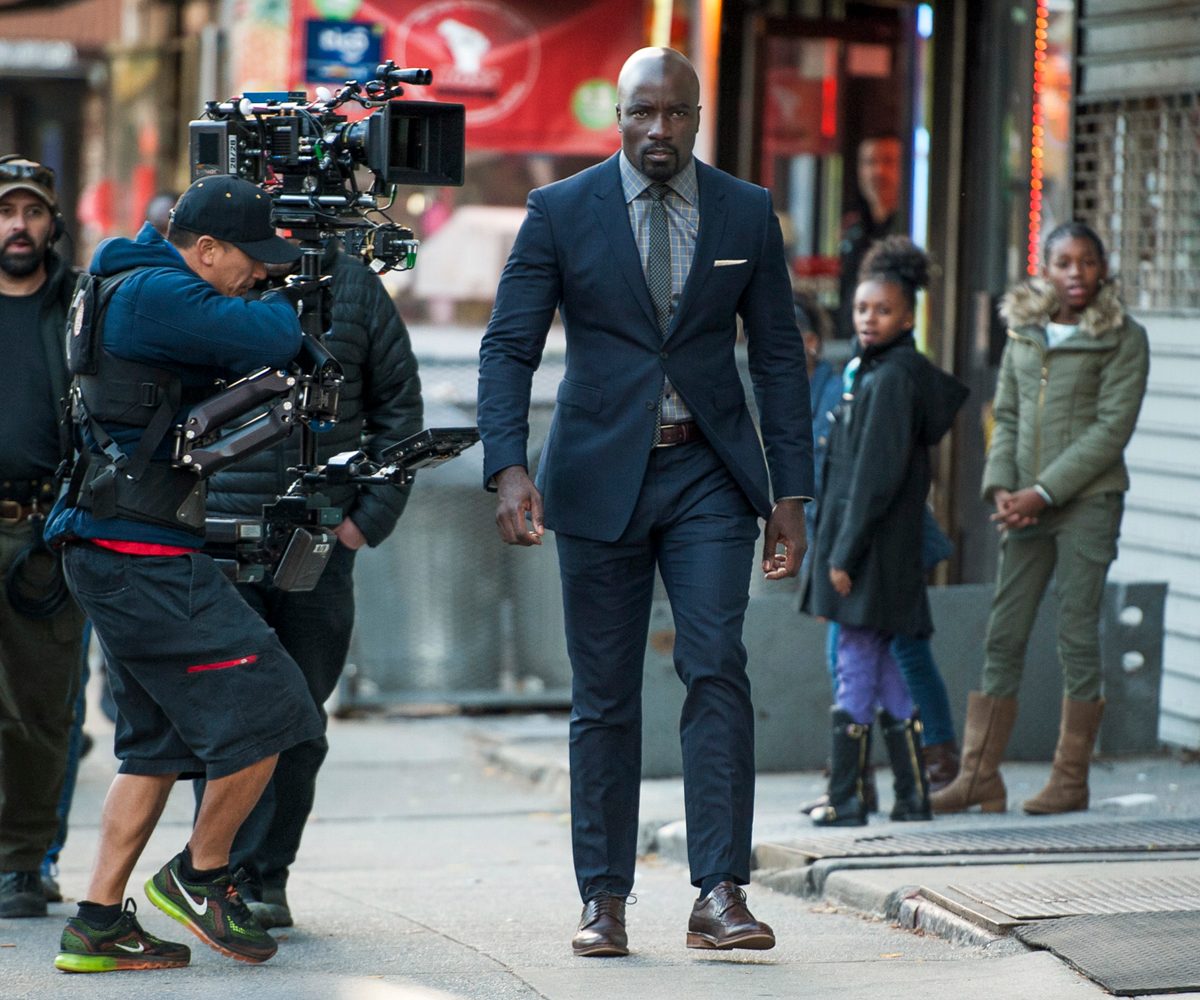 Gabe Hilfer interview — Behind the scenes shot of Luke Cage walking down the street being filmed.