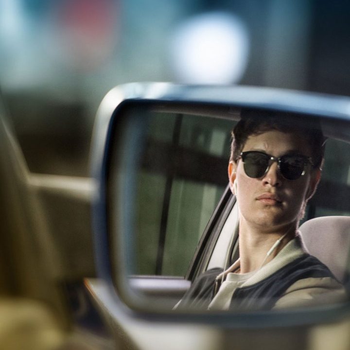A man looks in his rearview mirror in Baby Driver.