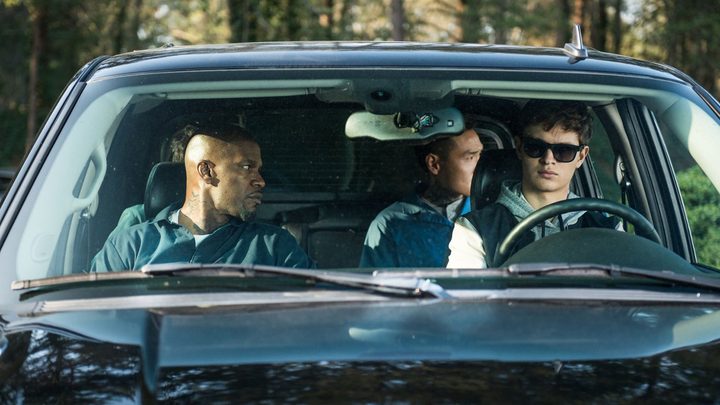 Three men sit in a car in Baby Driver.