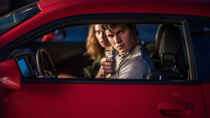 A man aims a gun in Baby Driver.
