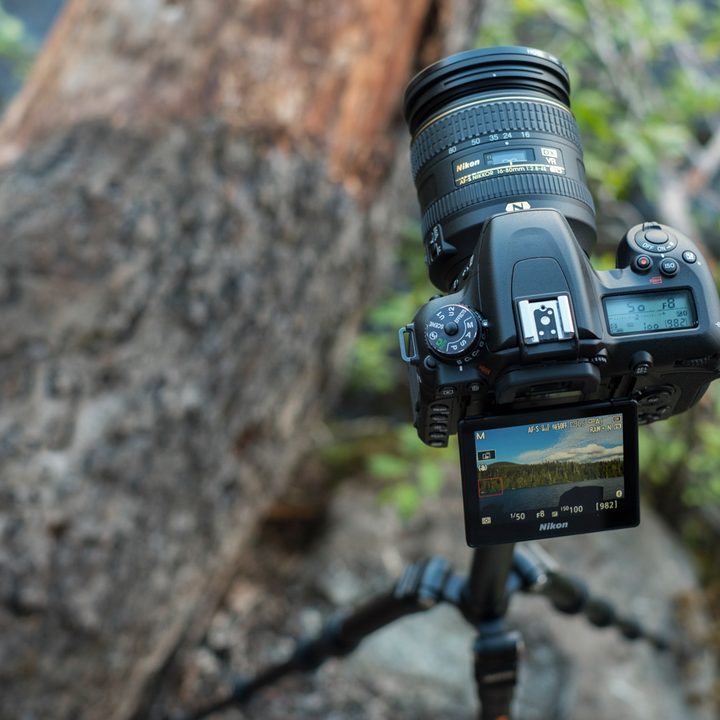 Top view of the D7500 on a tripod angled slightly, with the screen extended out