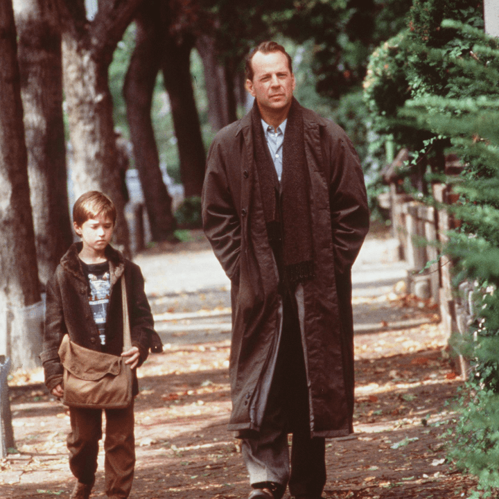 A man and a young boy walk alongside each other in The Sixth Sense.