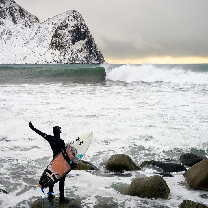 Snowboarder, Chris Burkard, standing in the arctic
