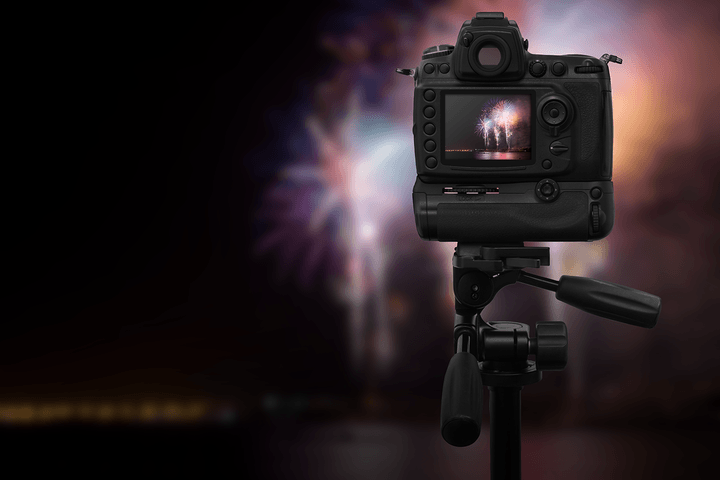 Photograph fireworks by setting up your camera ahead of time.