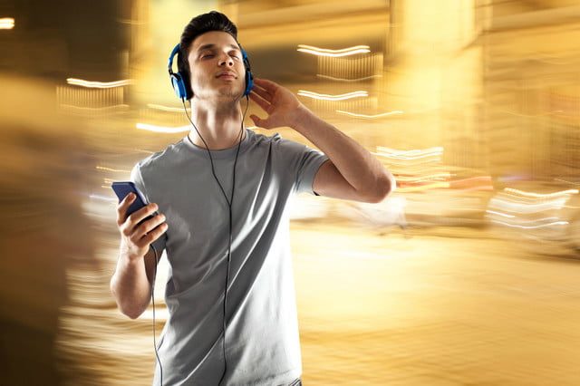 A person listening to music on headphones.