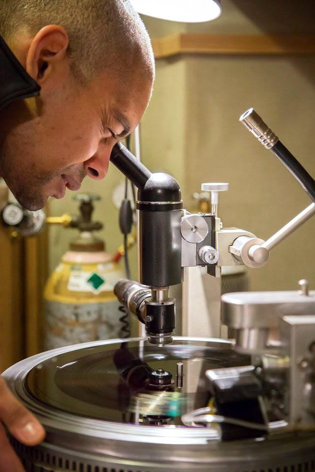 man-using-eye-pience-on-vinyl-manufacturing-machinery