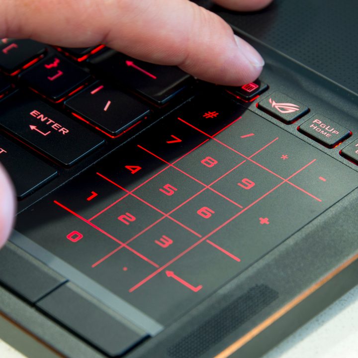 Asus ROG Zephyrus man using touchpad that's lit up red