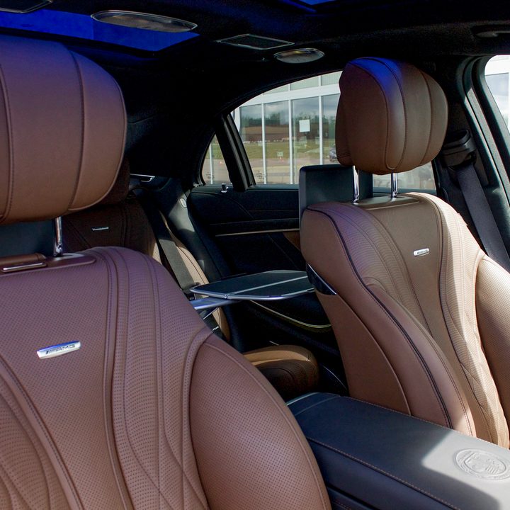 2018 Mercedes AMG S 63 angled shot of front leather seats and backseat from passenger side of car