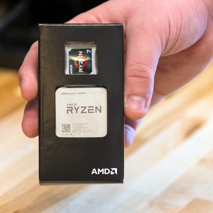 AMD Rizen CPU 7 box being held in a hand.