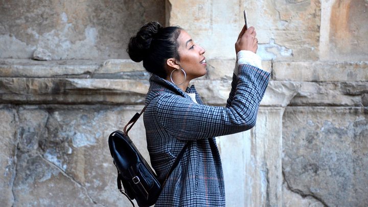 woman looking at cell phone