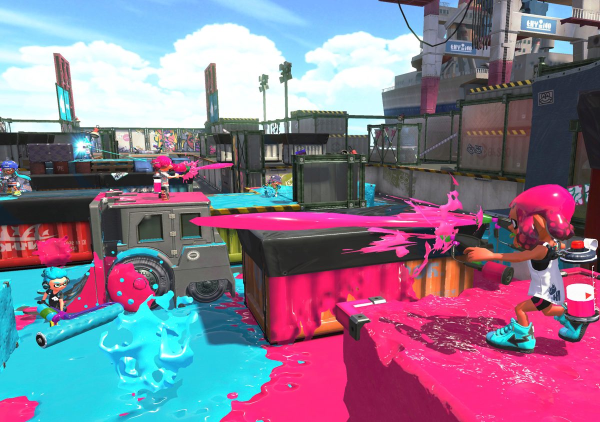 Splatoon 2 characters blasting each other with sky blue and vivid pink paint