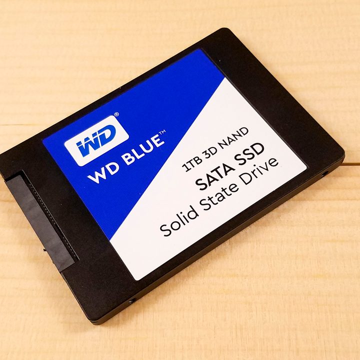 Western Digital Blue 3D NAND SATA SSD sitting flat on a table angled at 45 degrees