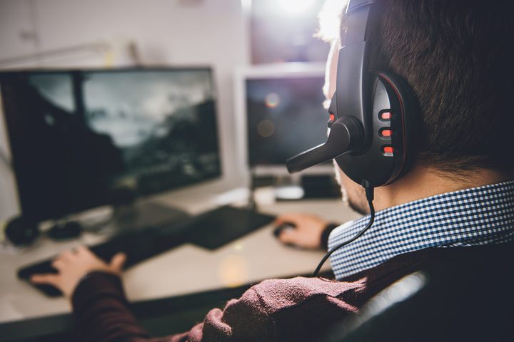 PC gamer wearing headset