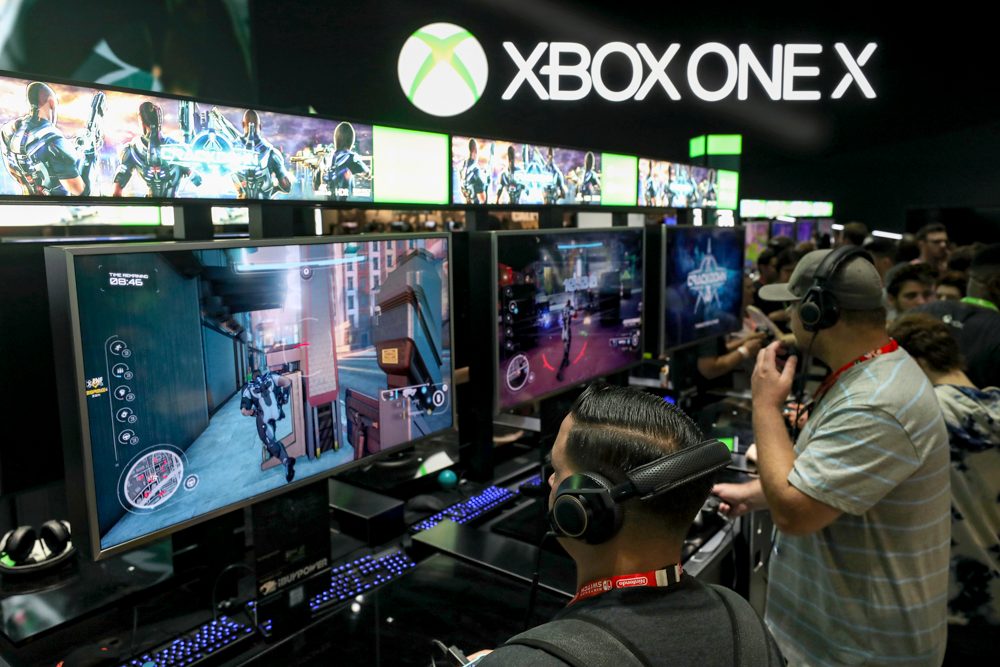 Mike Ybarra interview — Gamers test 'Crackdown' on the XBox One X during the Electronic Entertainment Expo E3 at the Los Angeles Convention Center on June 13, 2017 in Los Angeles, California.