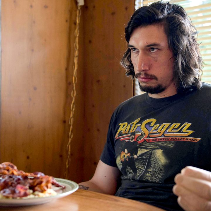 Clyde Logan (Adam Driver) stares intensely while at a diner eating breakfast