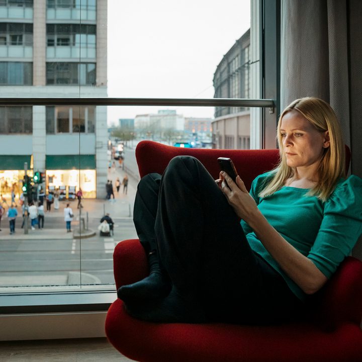 Woman using phone on 4G speeds