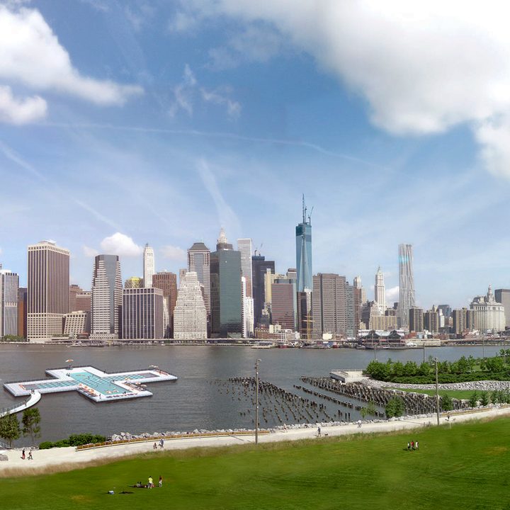 +Pool render showing it sitting in the river along a parks edge with the midday New York City skyline in the background