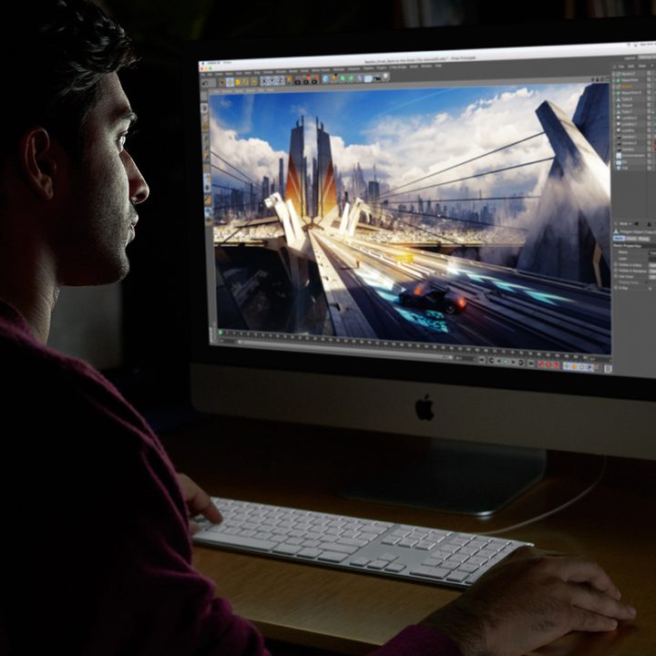 Man editing video on an Apple iMac Pro.