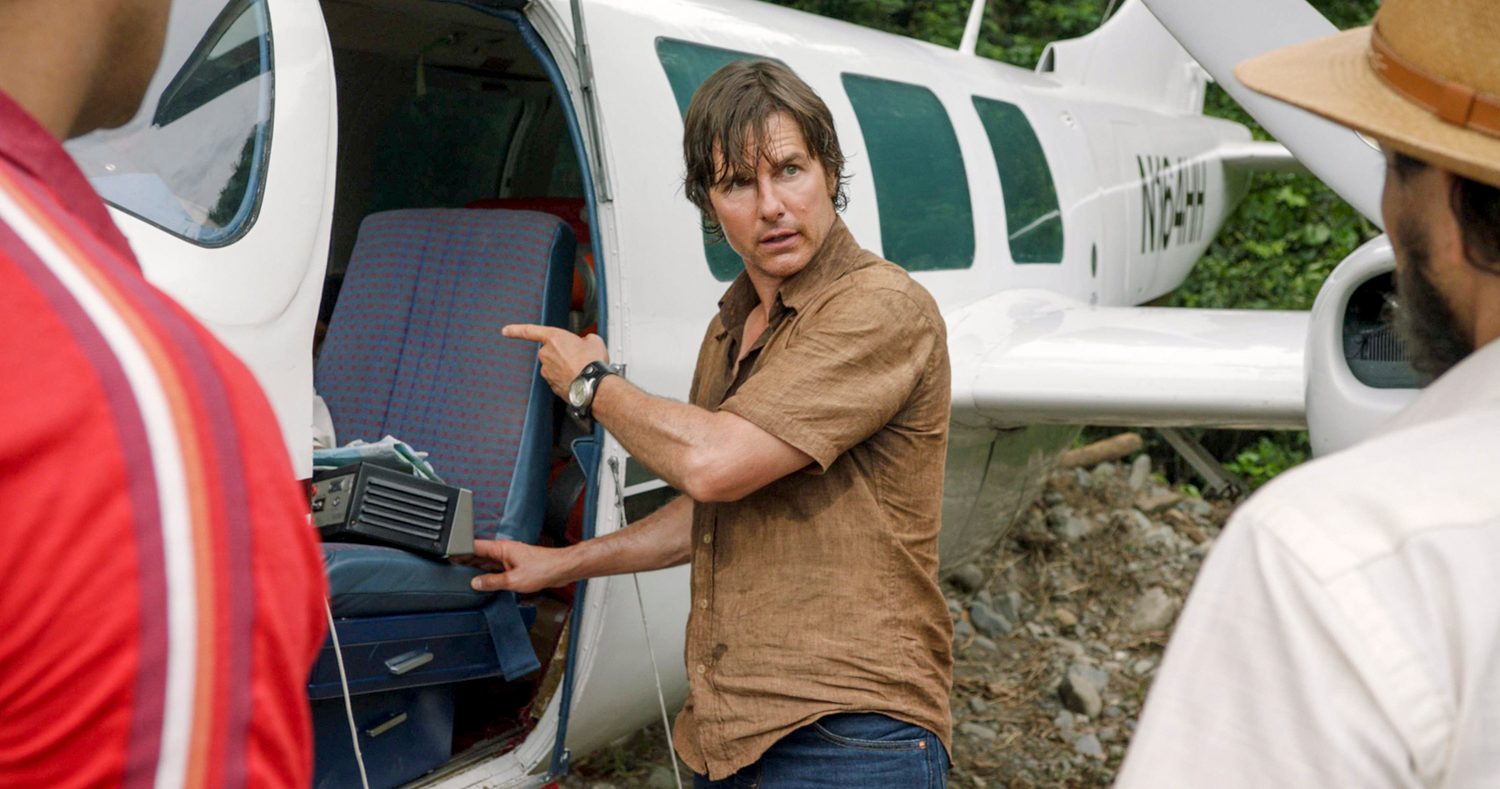 Tom Cruise pointing at a plane in American Made.