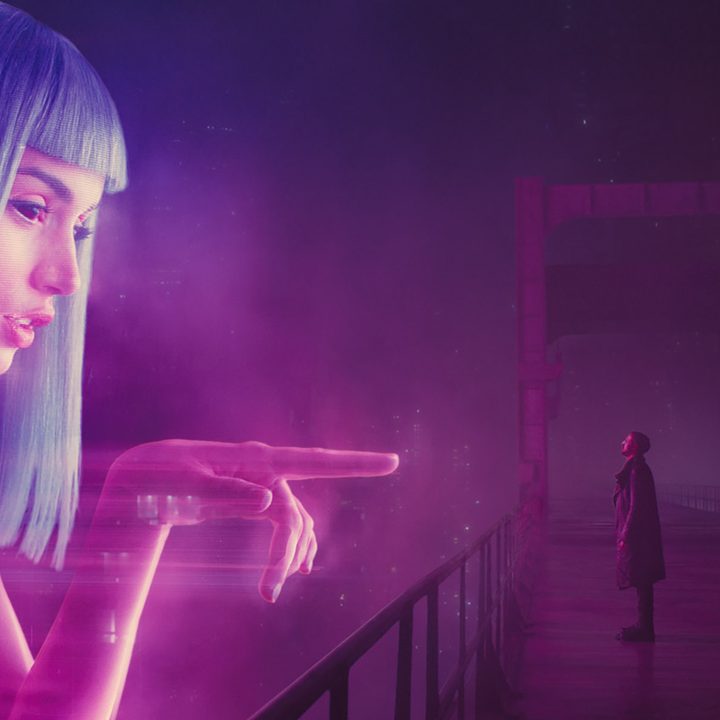 A giant hologram of Joi reaching out to K in Blade Runner 2049.
