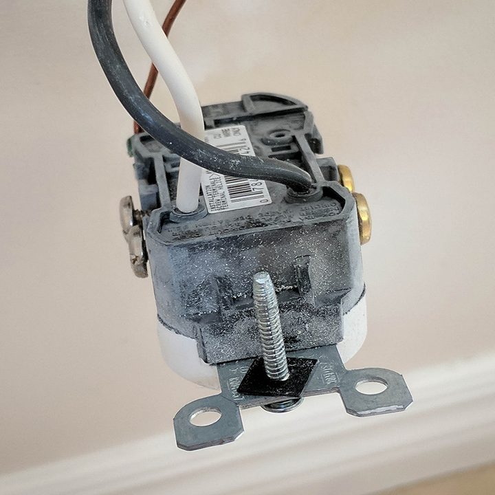 power outlet w/ exposed wiring