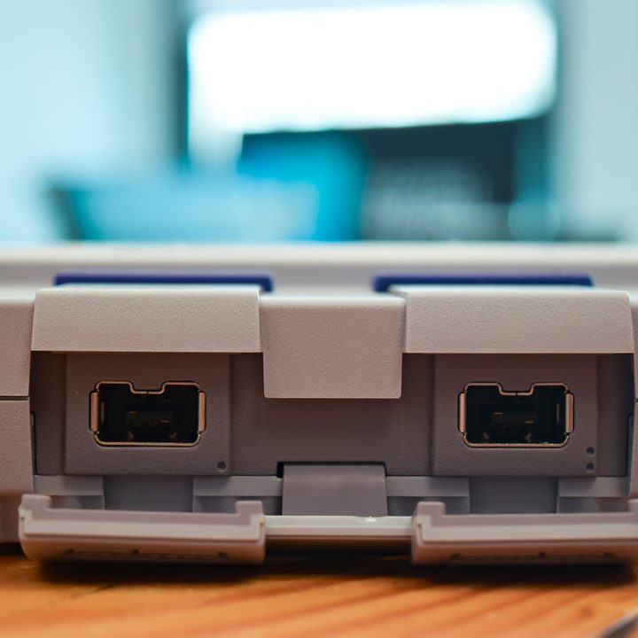 Frontside of the SNES Classic Edition showing off the actual controller ports with the athletic ports opened up