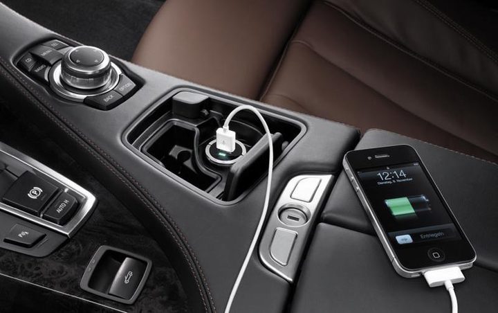 A phone plugged into a USB port in a car — USB Car Charger Hardly Works