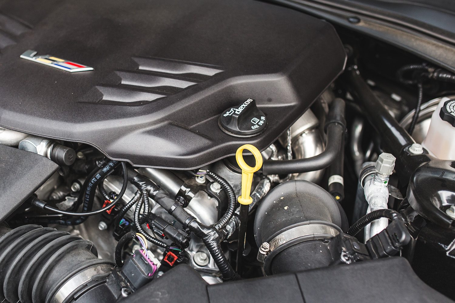 how to change the oil in your car 2017 cadillac ats v cap and dipstick