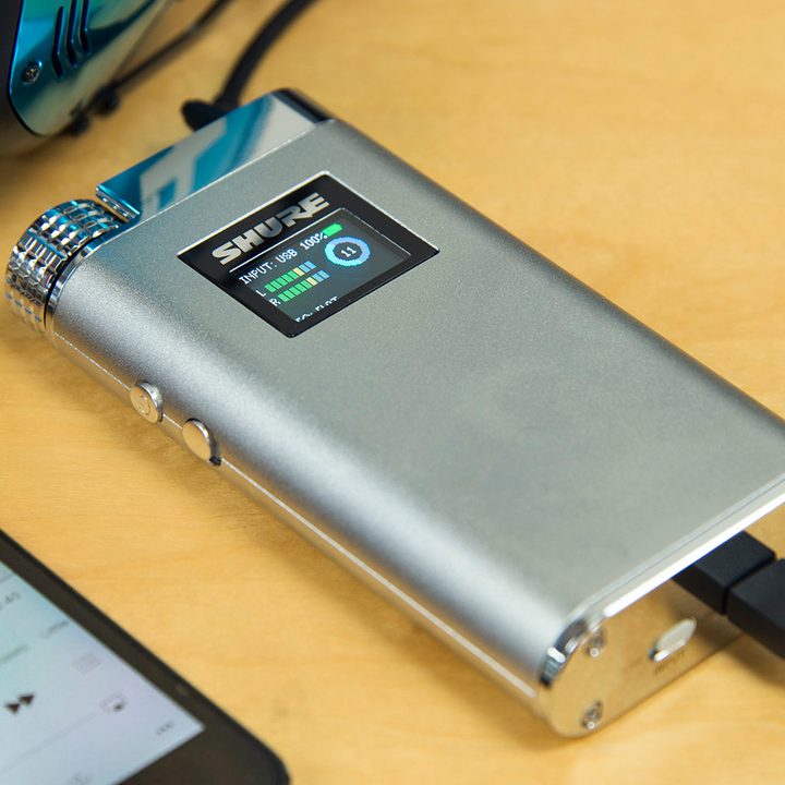 Shure SHA900 headphone amp connected to headphones.