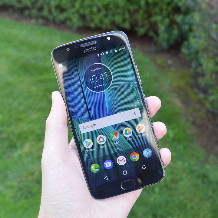 The Moto G5 Plus held in hand.