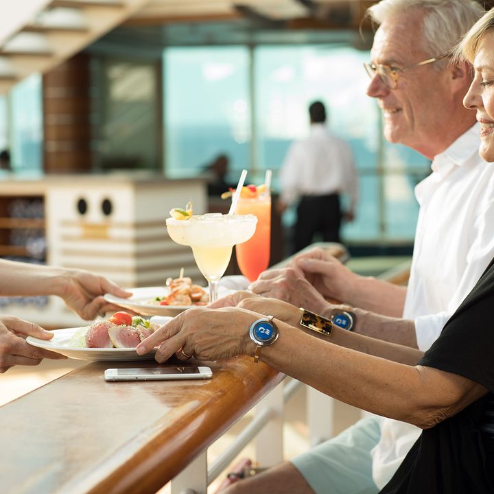 cruise ships turn to wearable tech create personalized experiences here now there then poolside bar