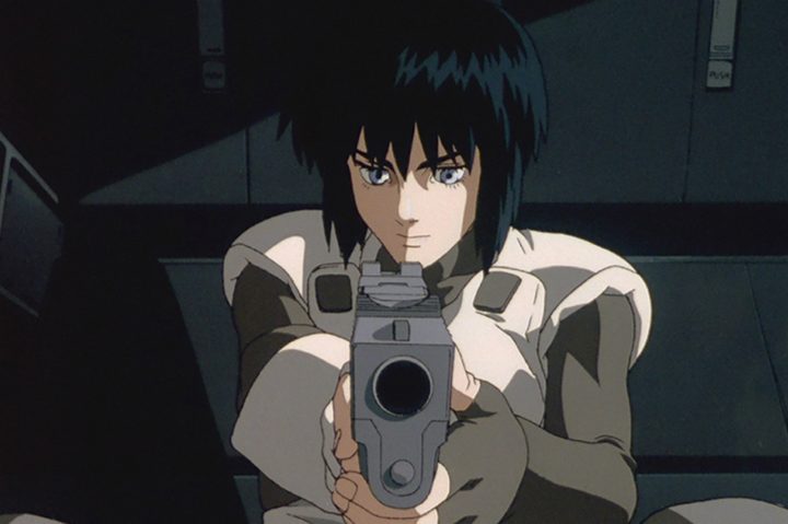 A character points a gun at the camera in Ghost in the Shell.