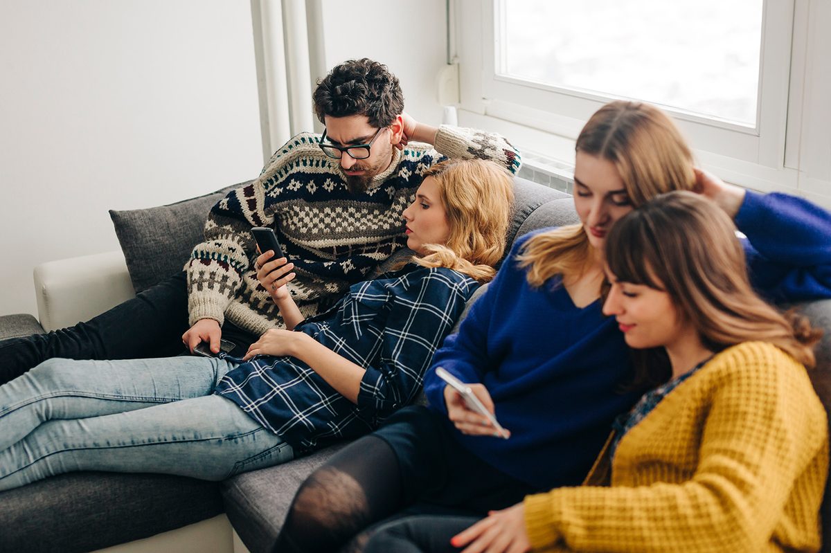 A group of people using smartphones