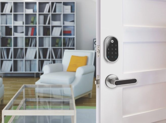 Nest x Yale Lock on open door.